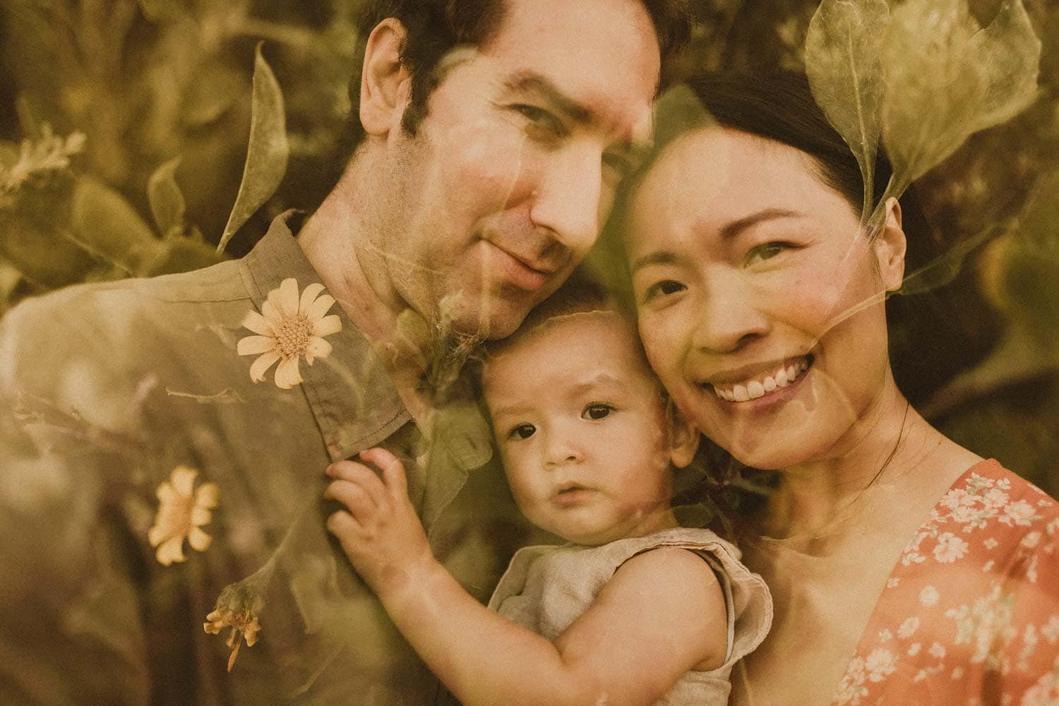 Family-photography-sydney-close-up-of-mum-dad-and-baby-with-flower-overlay