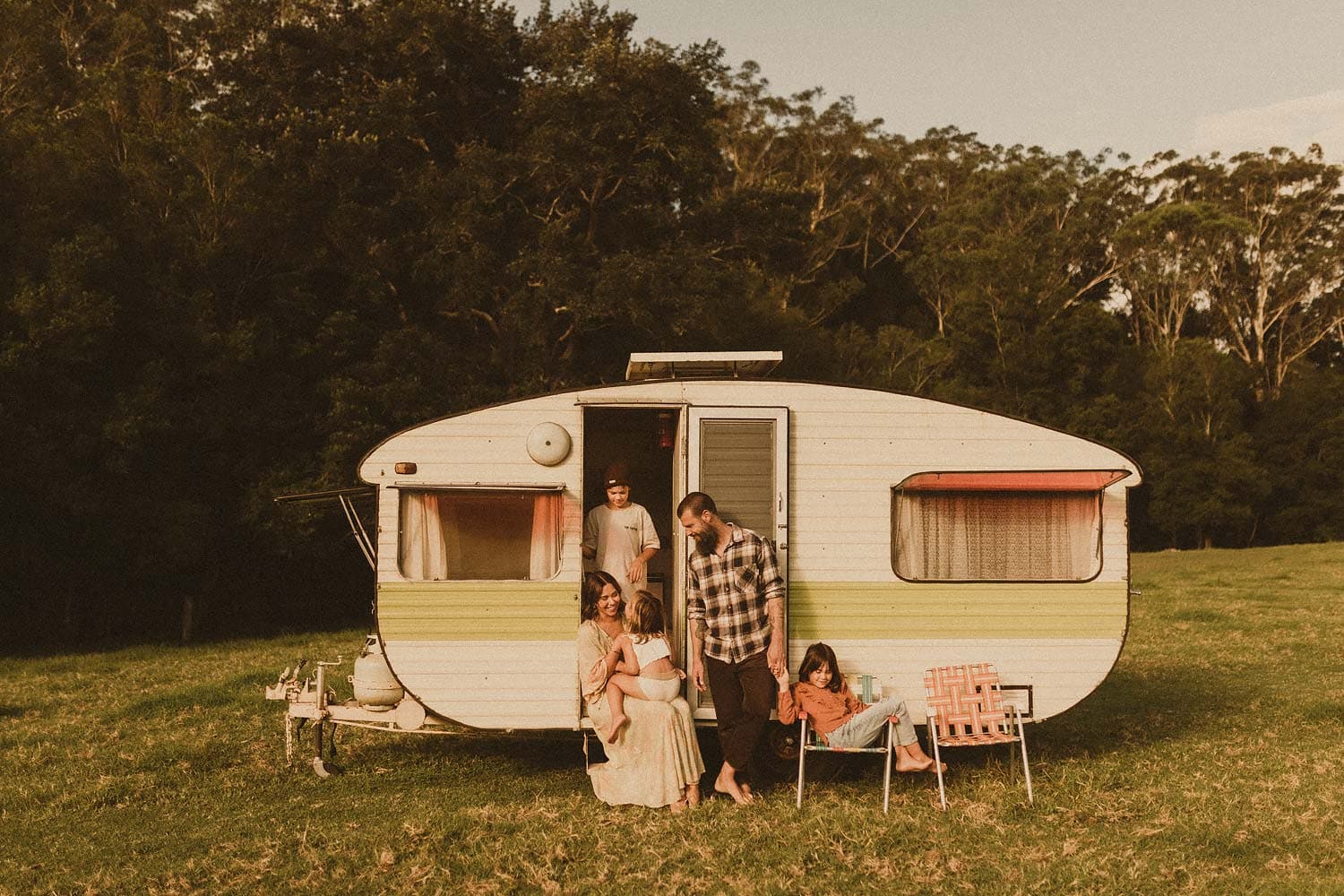 Family-photography-sydney-family-of-five-camping-in-retro-caravan-in-meadow