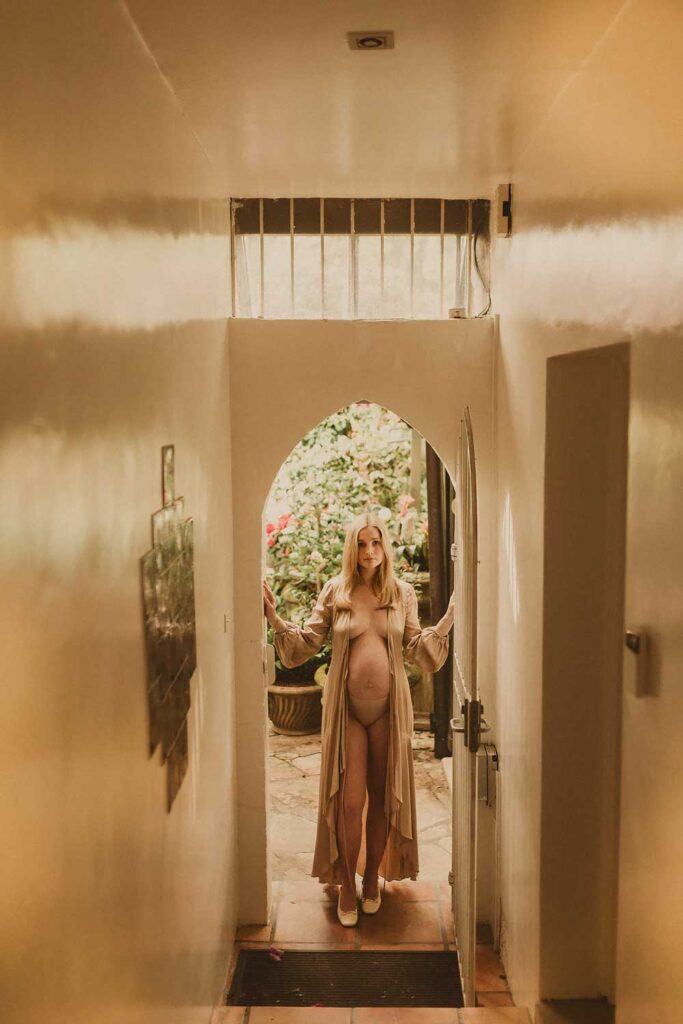 Pregnant mum standing in the doorway of her home during a relaxed Eastern Suburbs maternity session